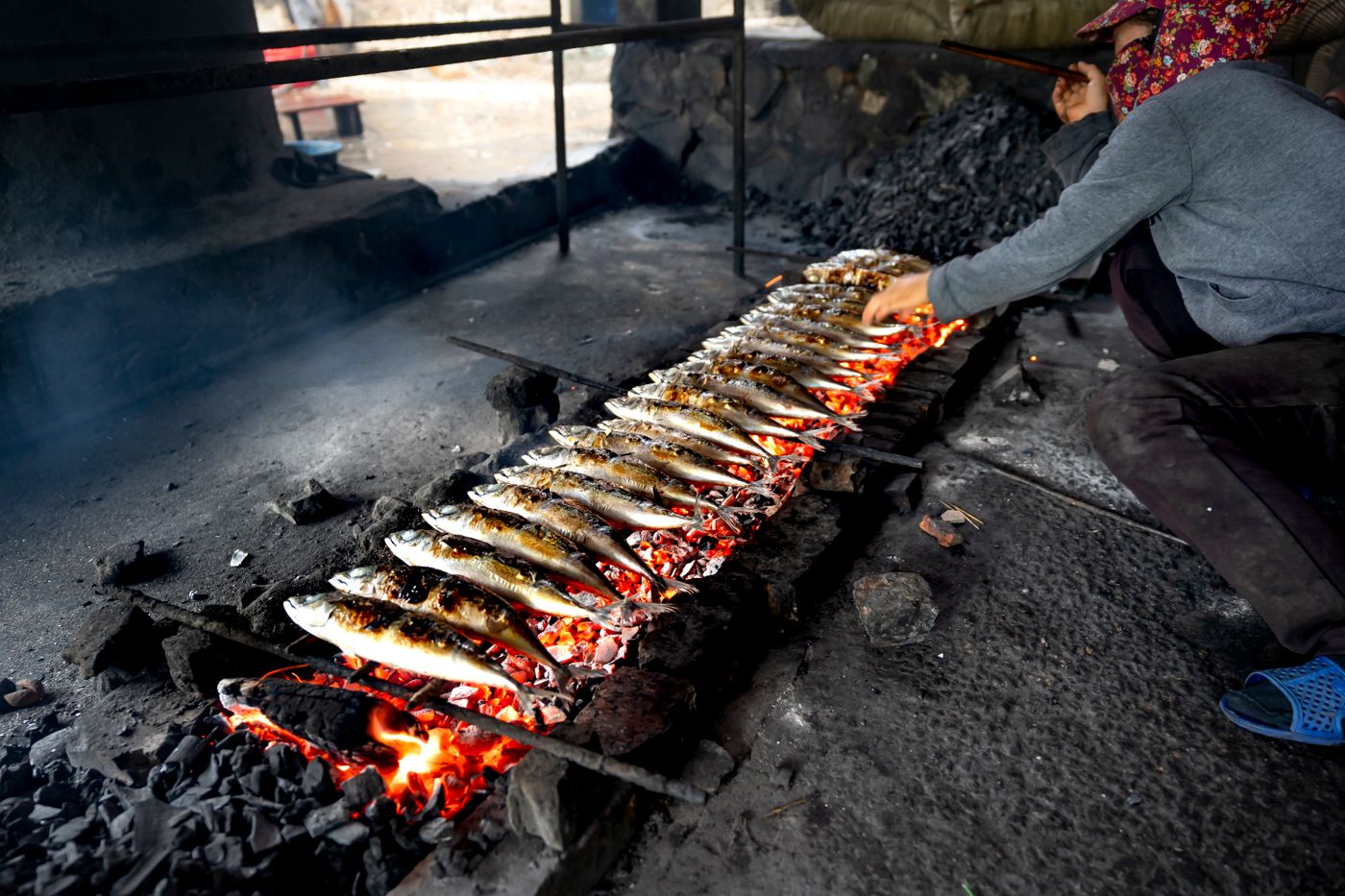 One fish on the grill at a time